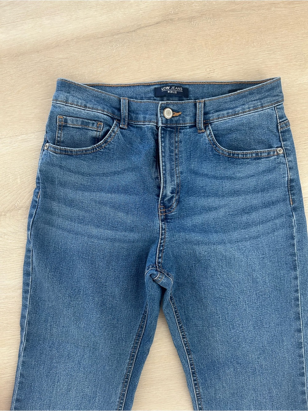 High-Rise Flared Women's Jeans in Medium Blue - Picture 5 of 8